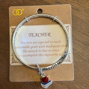Silver color bracelet for a teacher.  New in packaging.